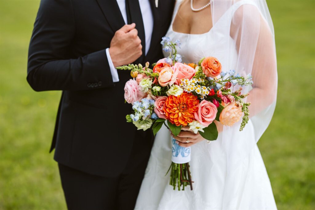romantic details of bridal bouquet and engagement ring