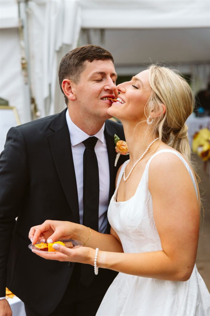 Bride and groom share charcuterie during their cocktail hour
